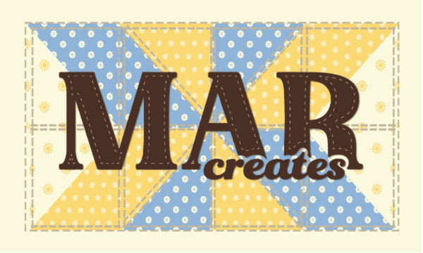 A square graphic with the words 'MAR creates' over a quilt-like patchwork background in light blue and yellow with white floral patterns, on a pale cream background.