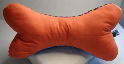 Side two of the Crayola bone pillow is a coordinating light orange fabric. 