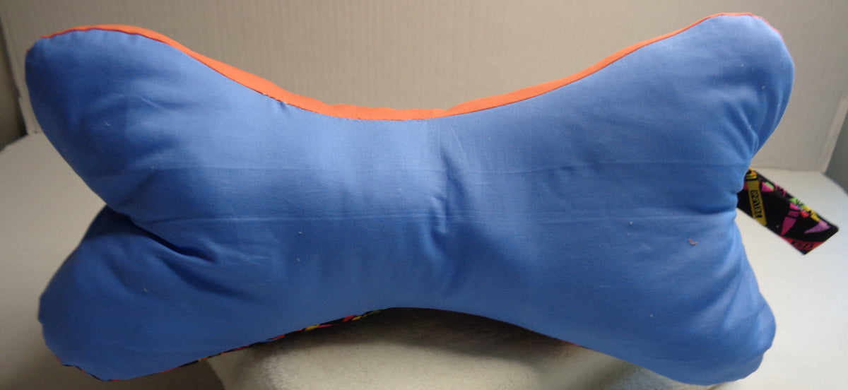 Side three of the Crayola bone pillow is a coordinating  medium blue fabric. 